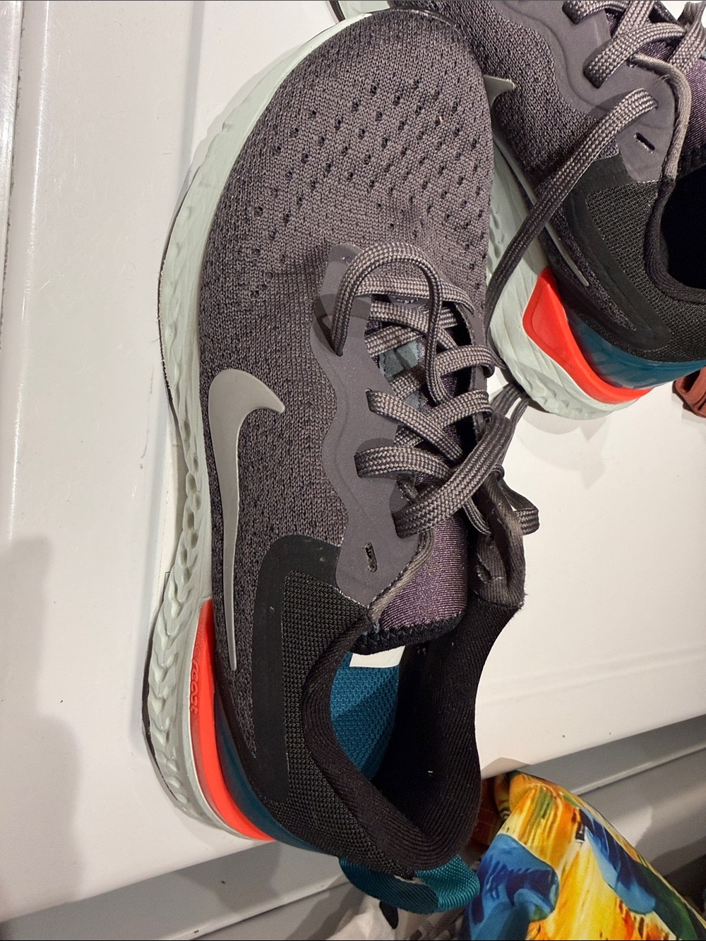 Nike Dark Gray Knit Running Shoes with Teal and Orange Accents
